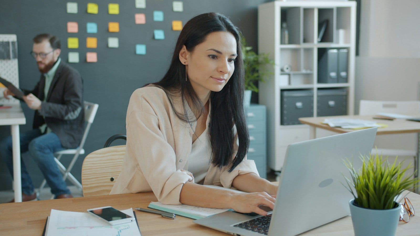 Professional working on a laptop in a modern office